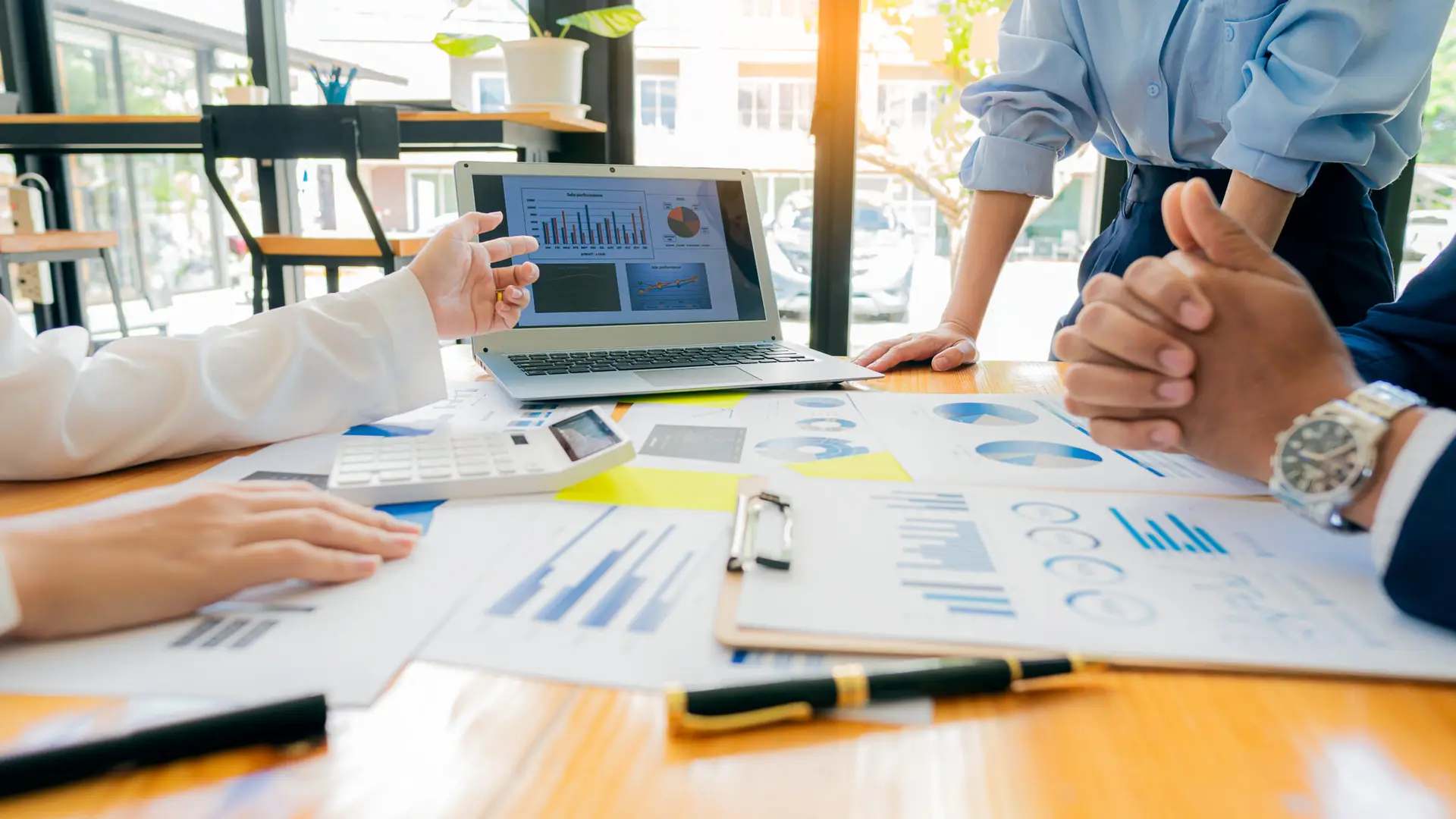 meeting with business people to discuss and brainstorm ideas on financial reports. the concept of working as a team of financial advisors and accounting, investments with a team at the office.